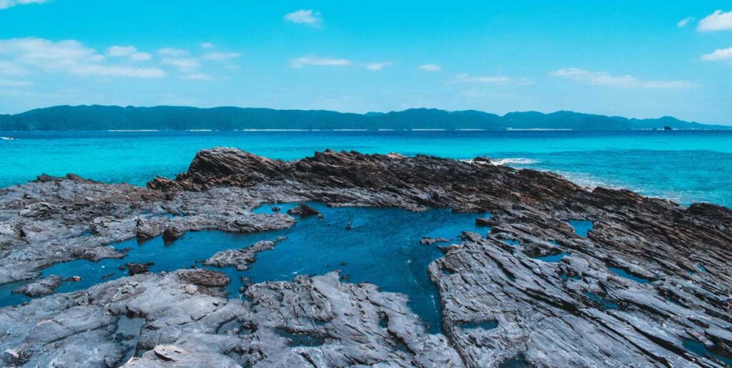 rocky shoreline of Zamami Island in Okinawa, Japan.