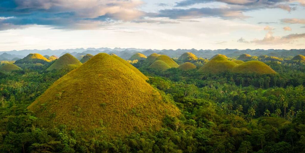 The image shows the famous Chocolate Hills on Bohol Island in the Philippines.