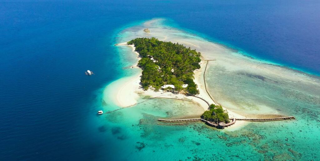 an aerial view of Little Liguid Island located near Samal Island in Mindanao, Philippines.